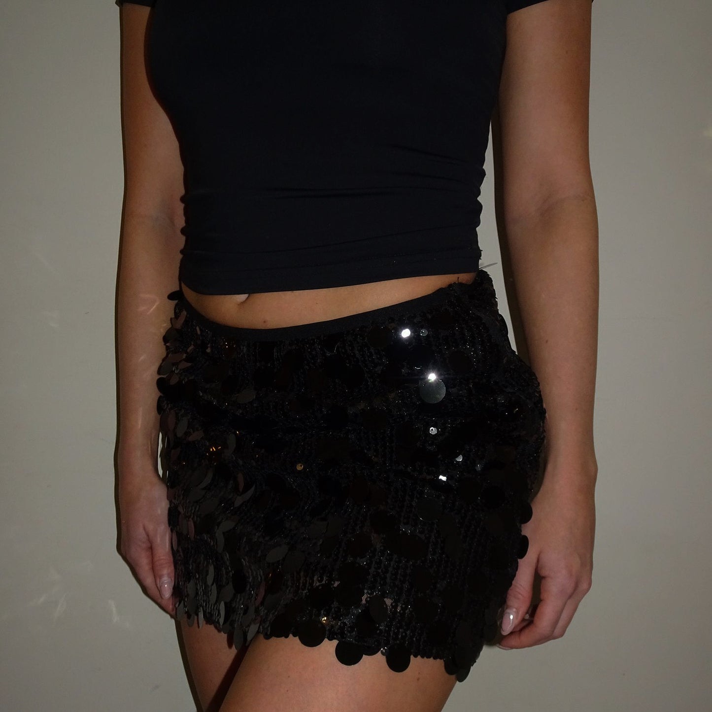 Black sequin mini skirt